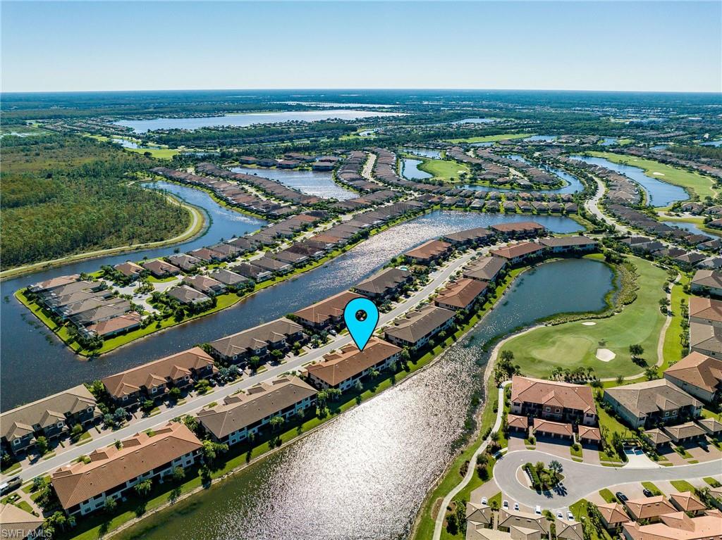 9650 Montelanico Loop, Unit 102 Naples, FL 34119 - Photo 19 of 36 an aerial view of a city