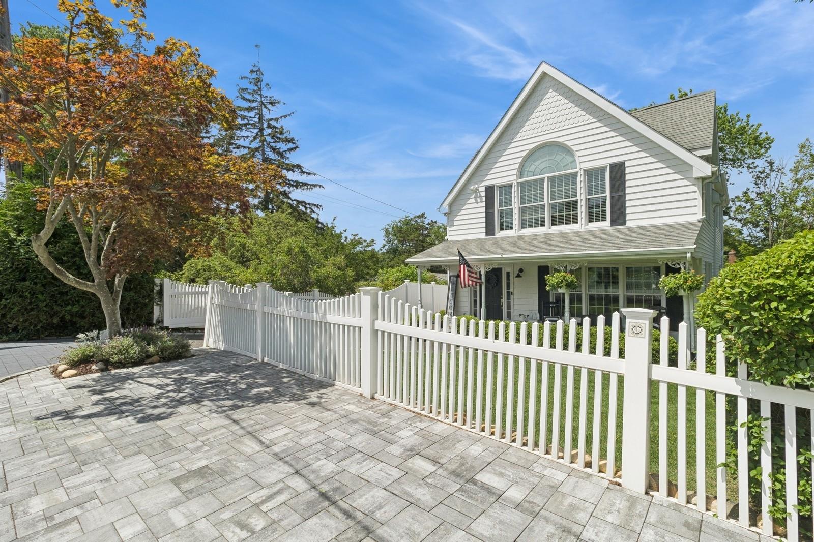 a front view of a house with a small yard