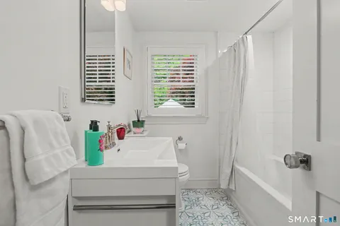 a bathroom with a bathtub and shower