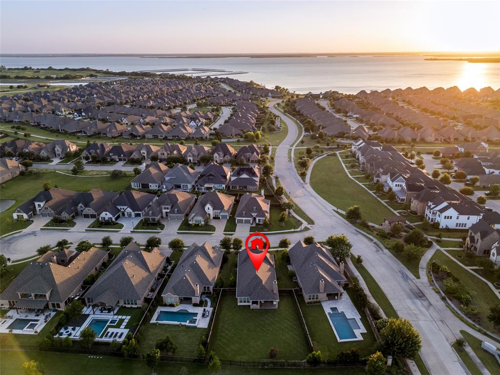 7821 Kentmere The Colony, TX 75056 - Photo 28 of 40 Perfectly positioned on a premium homesite backing to a scenic canal with tranquil water views and fountains, this exceptional residence also enjoys close proximity to the community's championship golf course and the shores of Lake Lewisville.