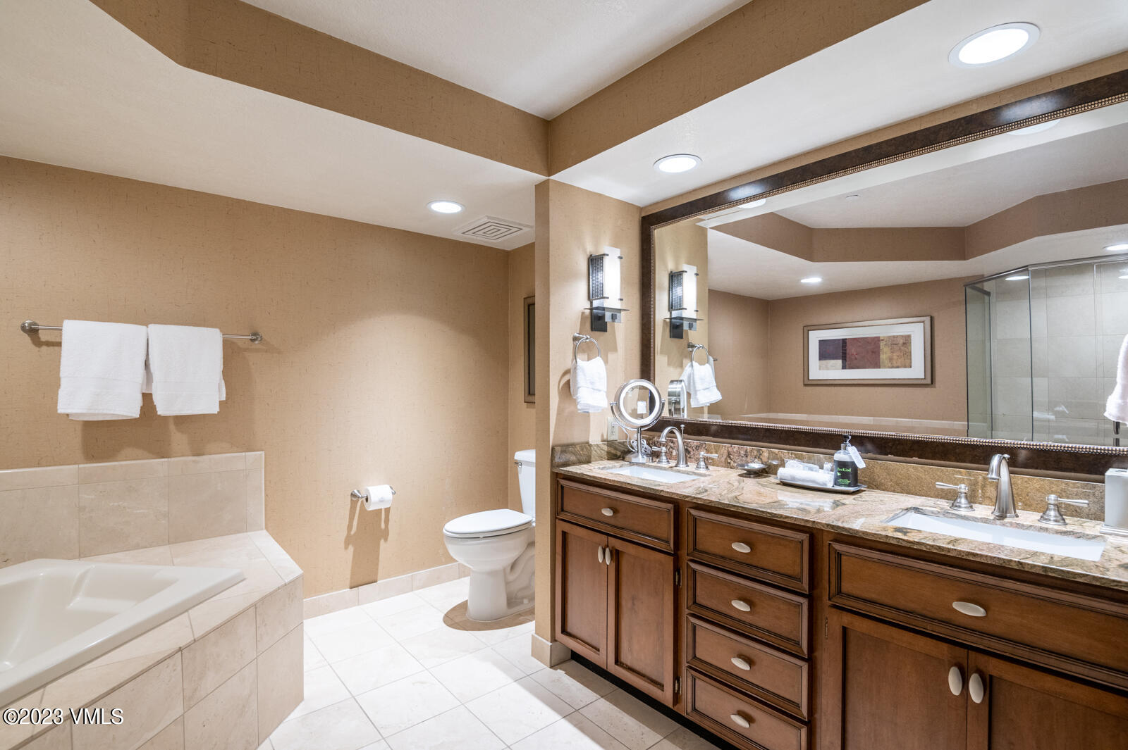 210 Offerson Road, Unit R310/WEEK 51 Beaver Creek, CO 81620 - Photo 23 of 35 a bathroom with a granite countertop double vanity sink a mirror and a toilet