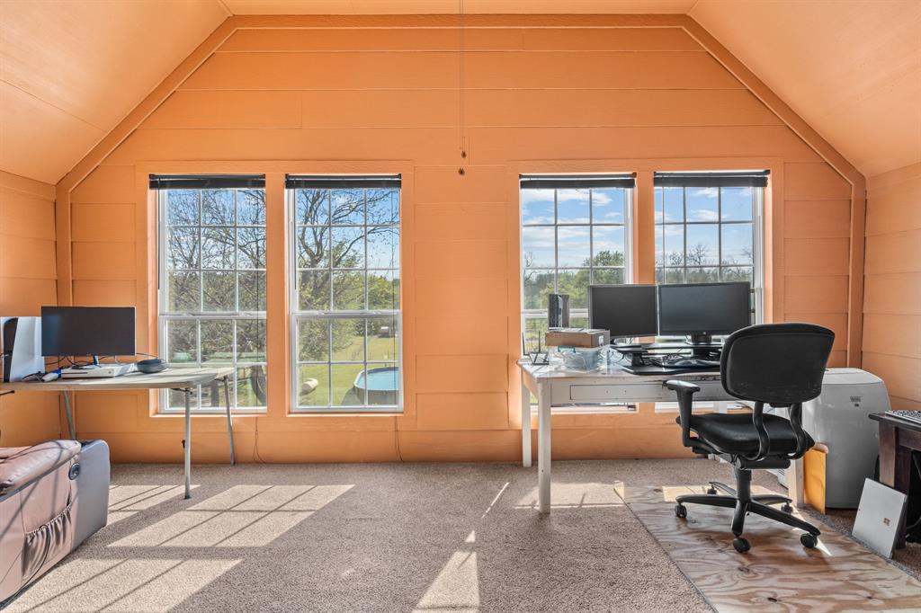 112 Waterfall Court Azle, TX 76020 - Photo 27 of 40 a view of a workspace with furniture and a window