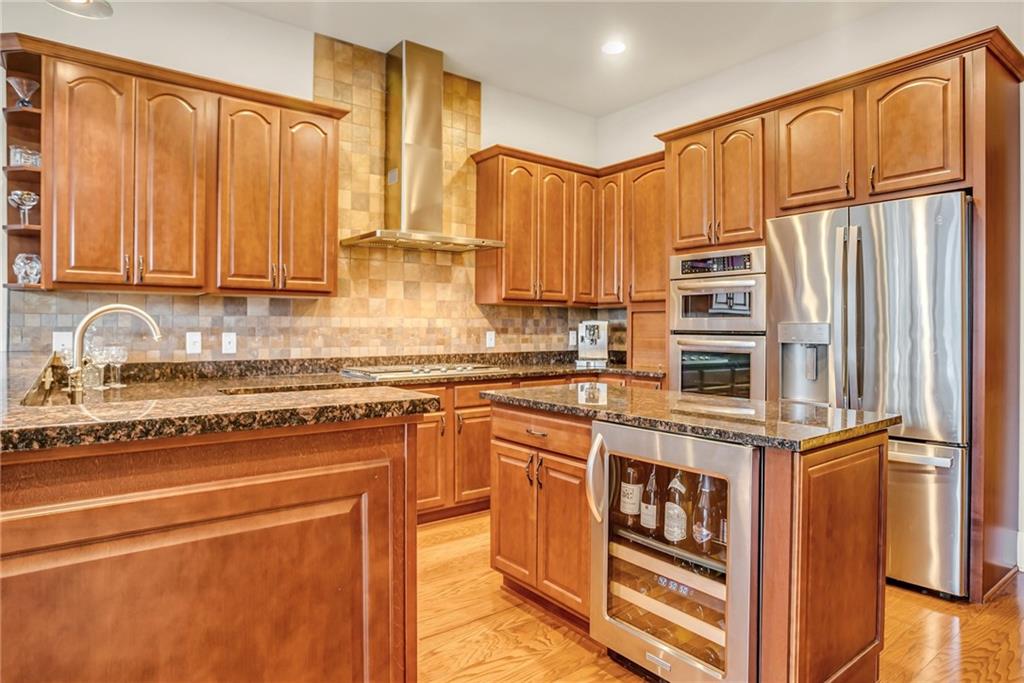 301 Fifth Avenue, Unit 702 Pittsburgh, PA 15222 - Photo 14 of 50 a kitchen with stainless steel appliances granite countertop a stove a sink and a refrigerator