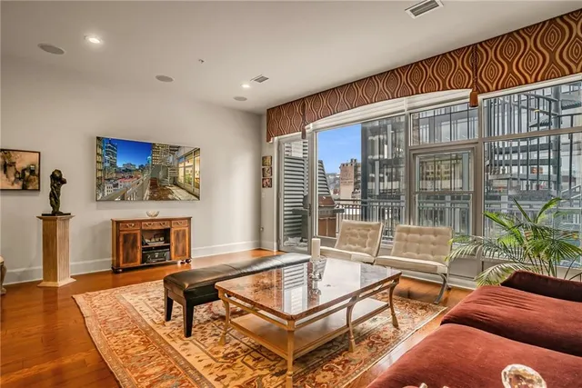 a living room with furniture a fireplace and a table