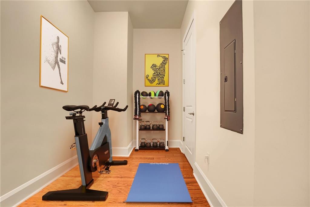 301 Fifth Avenue, Unit 702 Pittsburgh, PA 15222 - Photo 25 of 50 a room with gym equipment and a mirror
