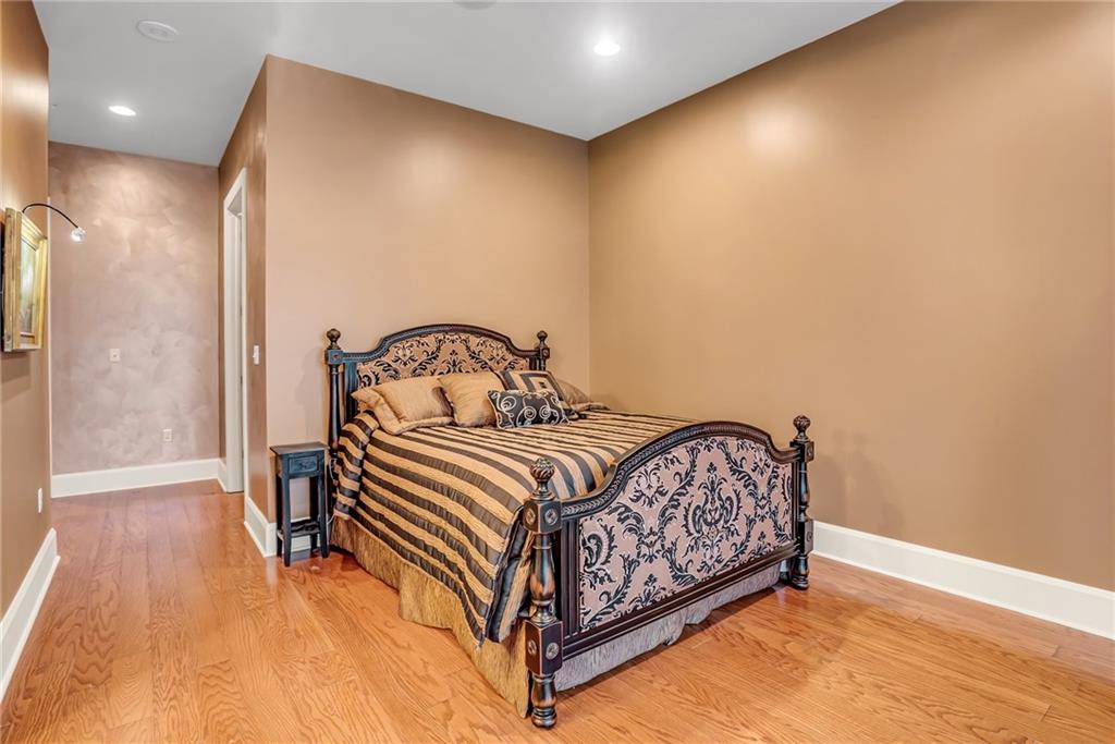 301 Fifth Avenue, Unit 702 Pittsburgh, PA 15222 - Photo 36 of 50 a bedroom with a bed and a mirror