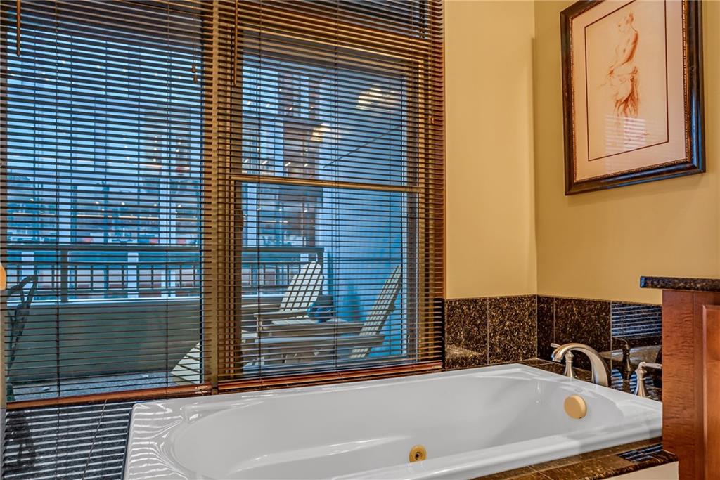 301 Fifth Avenue, Unit 702 Pittsburgh, PA 15222 - Photo 40 of 50 a bathroom with a bathtub and next to a window