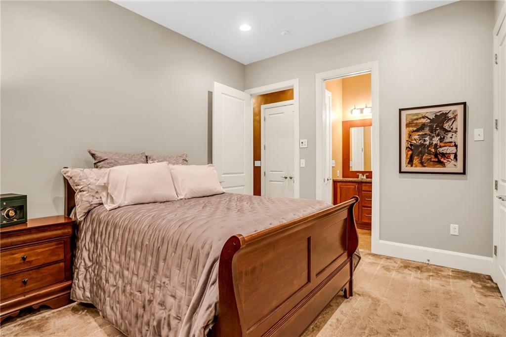 301 Fifth Avenue, Unit 702 Pittsburgh, PA 15222 - Photo 42 of 50 a bed room with a bed and a painting on the wall