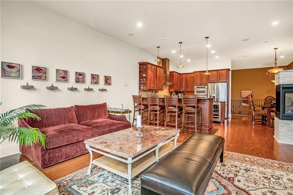 301 Fifth Avenue, Unit 702 Pittsburgh, PA 15222 - Photo 8 of 50 a living room with furniture kitchen view and a table