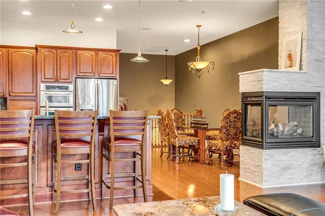 a living room with lots of furniture and a painting on the wall
