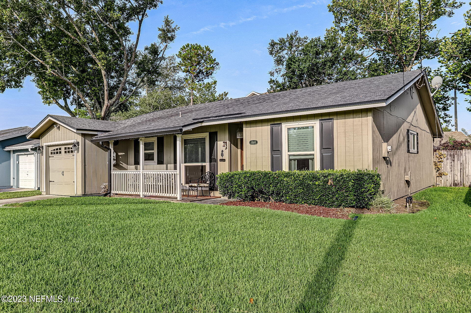 3866 Eunice Road Jacksonville, FL 32250 - Photo 1 of 41 a front view of a house with a yard and garage