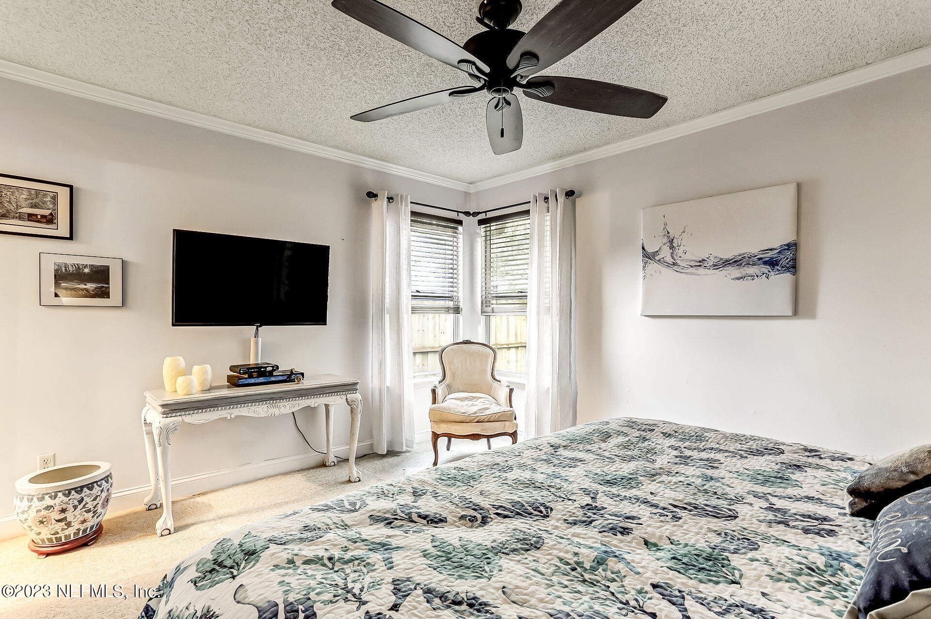 3866 Eunice Road Jacksonville, FL 32250 - Photo 13 of 41 a bedroom with a bed and a flat screen tv