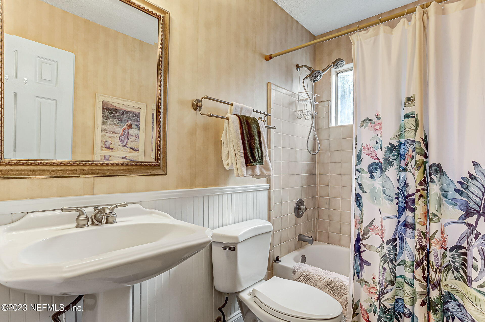 3866 Eunice Road Jacksonville, FL 32250 - Photo 21 of 41 a bathroom with a sink toilet and shower