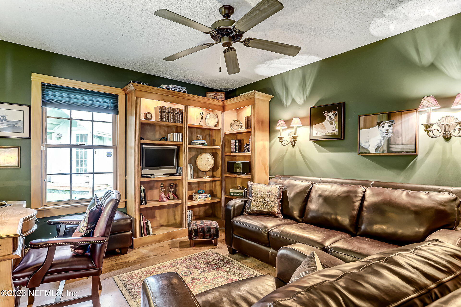 3866 Eunice Road Jacksonville, FL 32250 - Photo 22 of 41 a living room with furniture and a flat screen tv