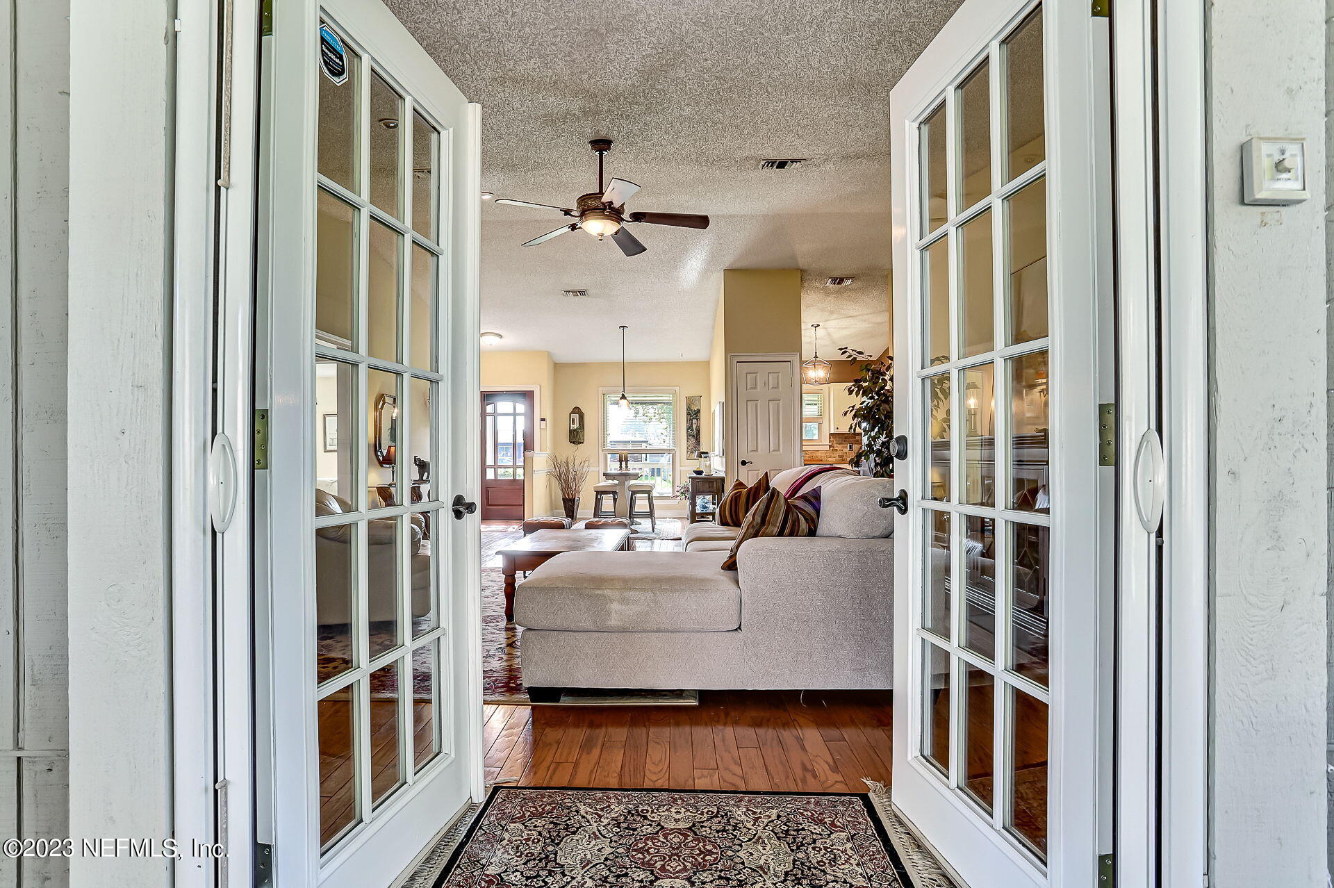 3866 Eunice Road Jacksonville, FL 32250 - Photo 33 of 41 a living room with furniture and a rug