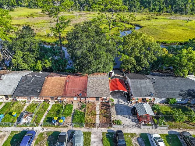 an aerial view of residential house with outdoor space and swimming pool