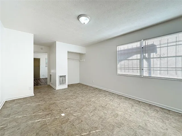 an empty room with windows