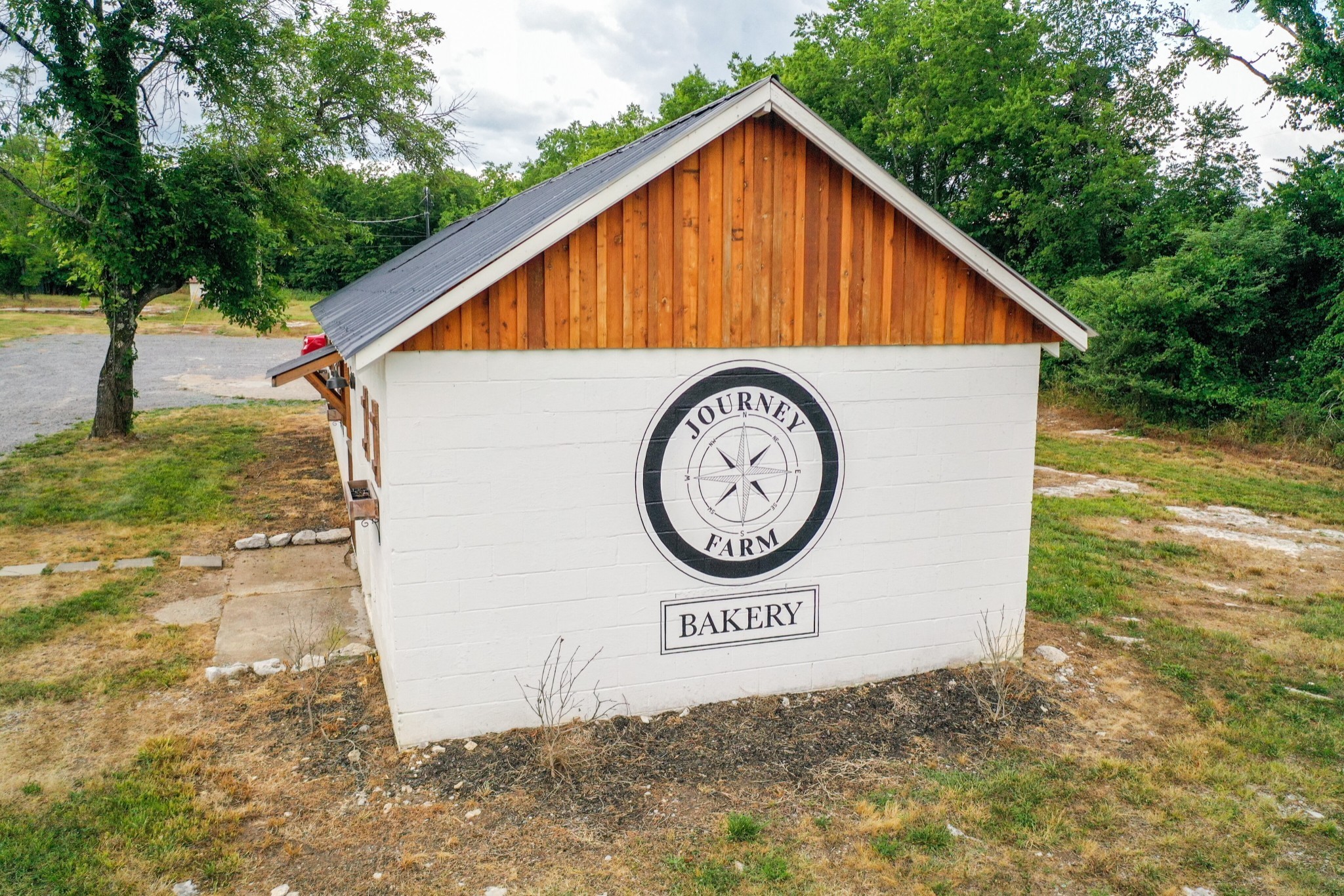 1638 Alsup Mill Road Lascassas, TN 37085 - Photo 52 of 63 a view of a house with a small yard and a sign board