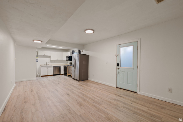 594 850 West Provo, UT 84601 - Photo 23 of 33 Open-concept living space with light wood-finish flooring, white walls, and recessed lighting