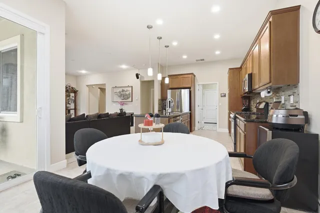 a dining room with furniture and window