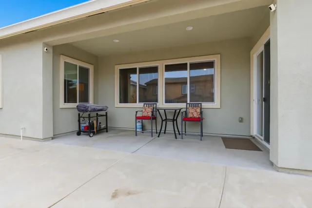 a view of a room with furniture and a window