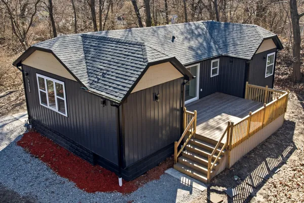 a view of a roof deck with wooden floor and fence