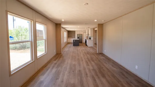 a bathroom with a granite countertop sink a toilet and a mirror