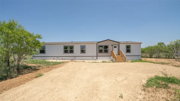 front view of a house with a patio