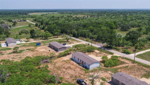 an aerial view of a house with a garden