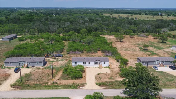 an aerial view of a house with a lake view