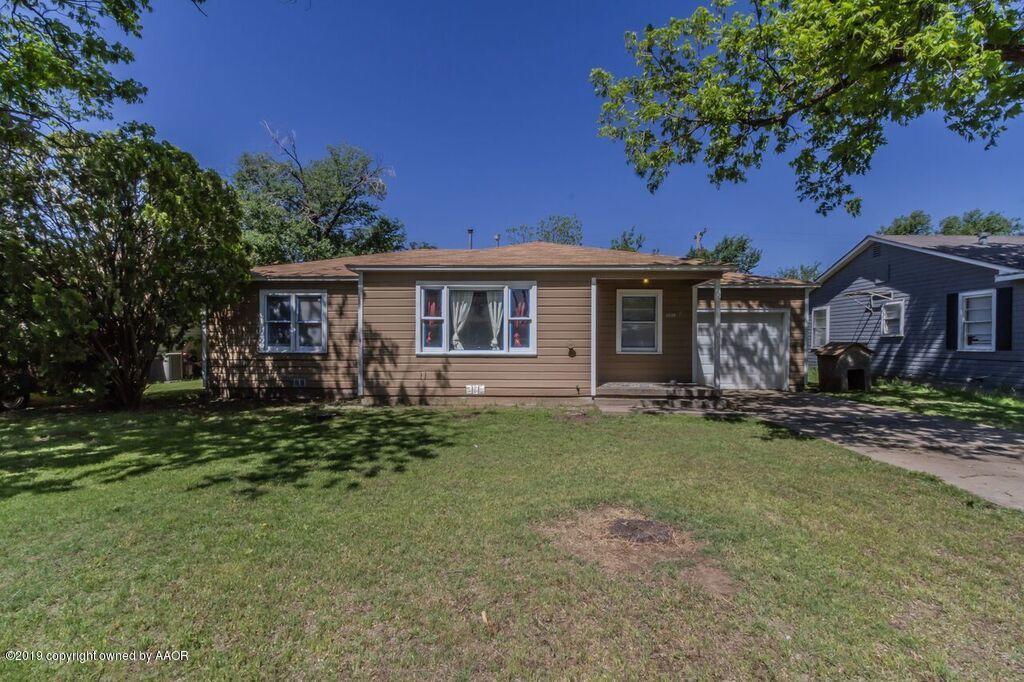 4308 South Travis Street Amarillo, TX 79110 - Photo 2 of 32 a view of a house with a backyard