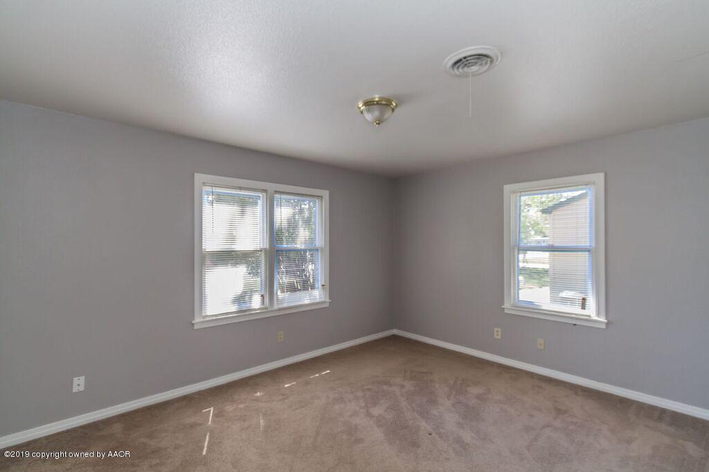 4308 South Travis Street Amarillo, TX 79110 - Photo 22 of 32 an empty room with a window