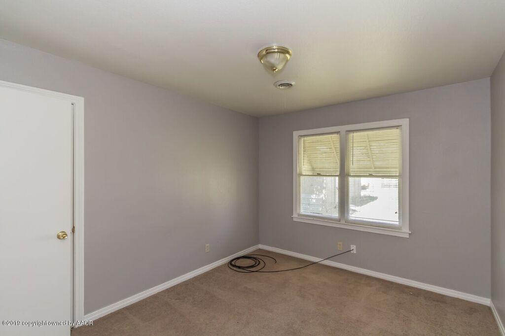 4308 South Travis Street Amarillo, TX 79110 - Photo 28 of 32 a view of an empty room with a window