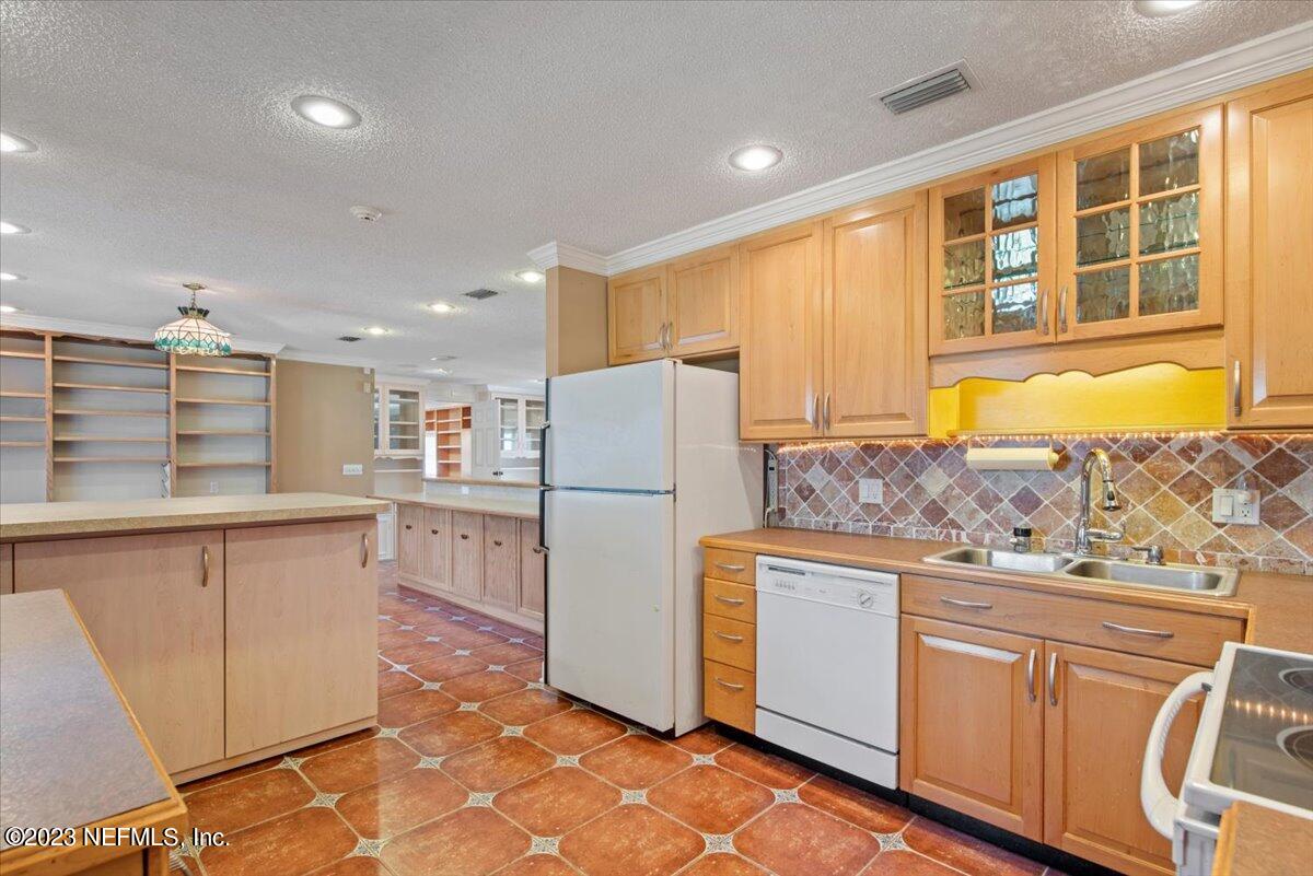 3048 Stratton Lane Jacksonville, FL 32221 - Photo 13 of 41 a kitchen with granite countertop cabinets and refrigerator