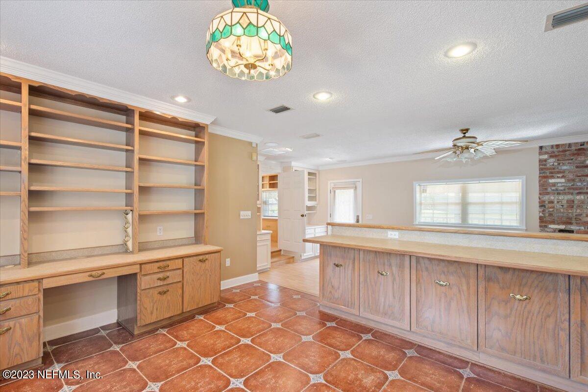 3048 Stratton Lane Jacksonville, FL 32221 - Photo 15 of 41 a large kitchen with a large window appliances and cabinets