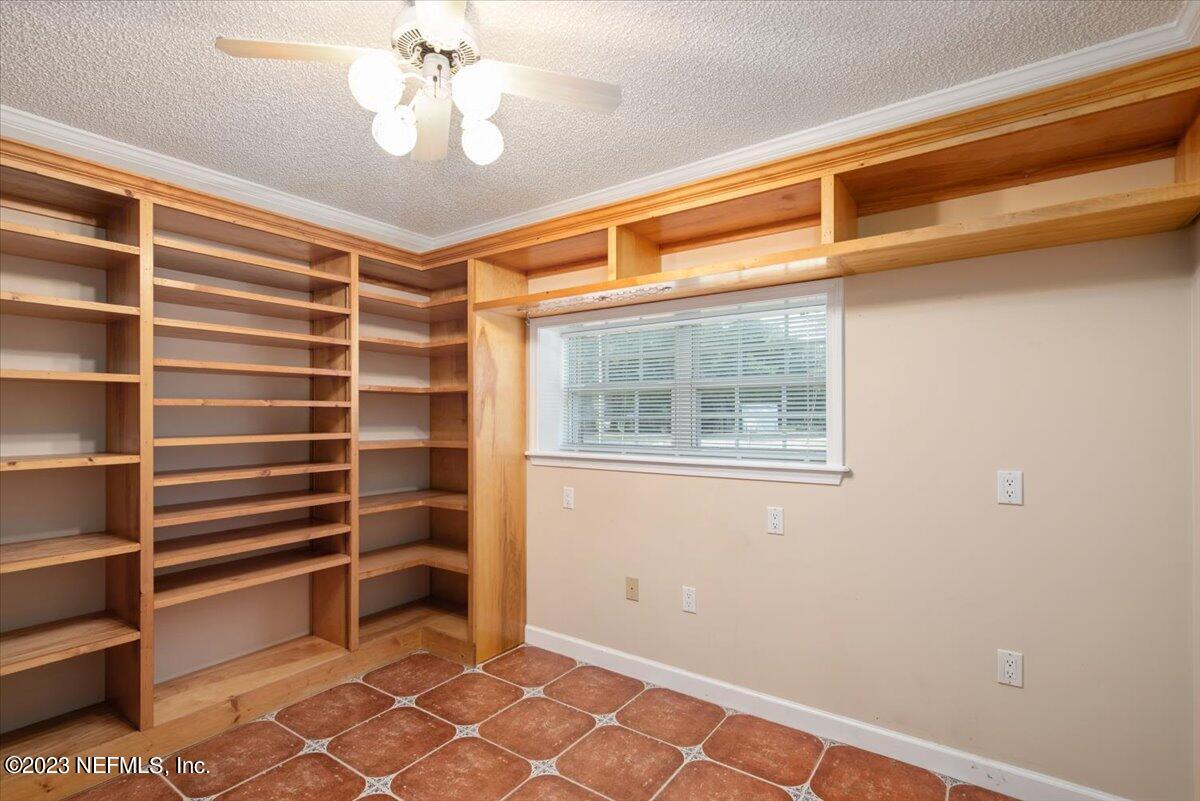 3048 Stratton Lane Jacksonville, FL 32221 - Photo 16 of 41 a view of an empty room with a cabinet and a window
