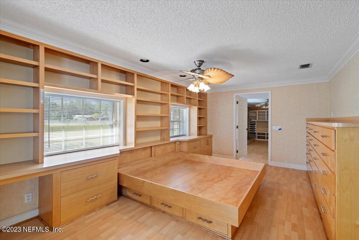 3048 Stratton Lane Jacksonville, FL 32221 - Photo 17 of 41 a spacious bedroom with a large bed and a window