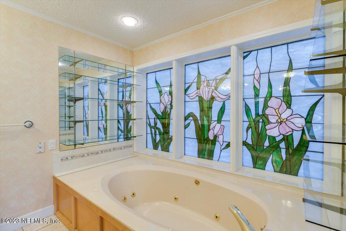 3048 Stratton Lane Jacksonville, FL 32221 - Photo 18 of 41 a bathroom with a bathtub and a shower