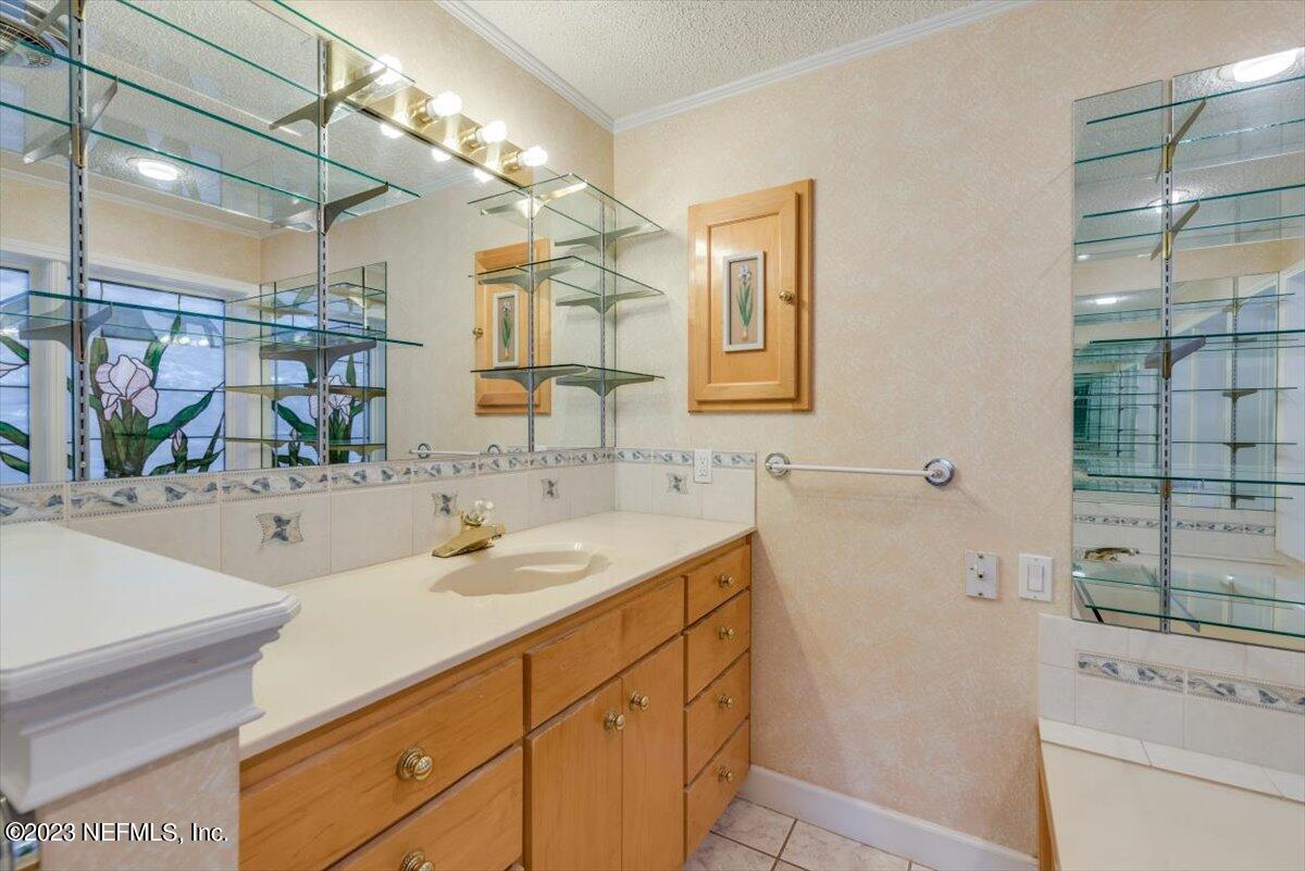 3048 Stratton Lane Jacksonville, FL 32221 - Photo 19 of 41 a bathroom with a sink and a mirror