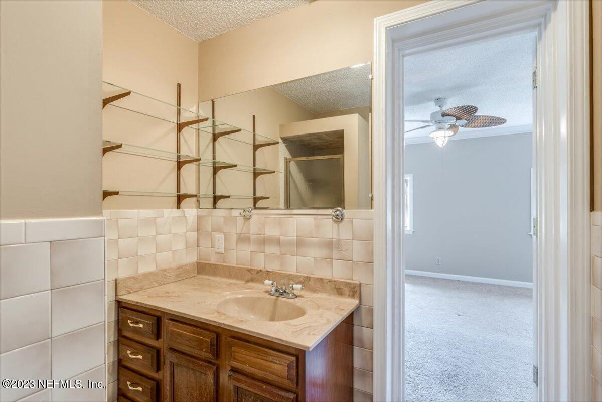 3048 Stratton Lane Jacksonville, FL 32221 - Photo 22 of 41 a bathroom with a sink and a mirror