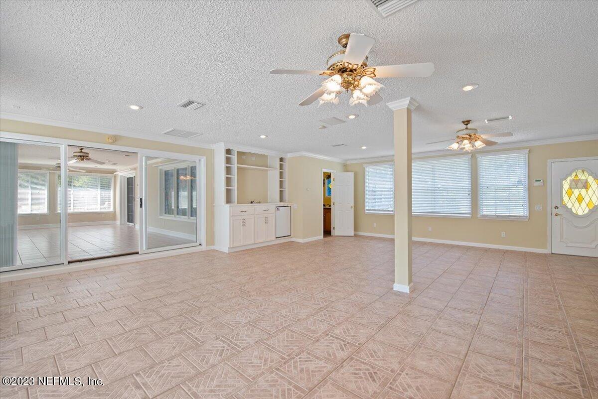 3048 Stratton Lane Jacksonville, FL 32221 - Photo 24 of 41 a view of an empty room and a chandelier fan