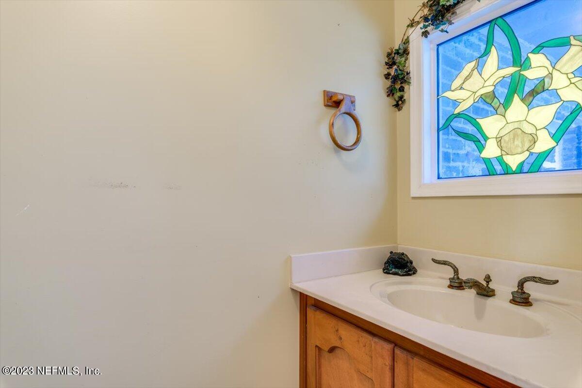 3048 Stratton Lane Jacksonville, FL 32221 - Photo 27 of 41 a bathroom with a sink and a mirror