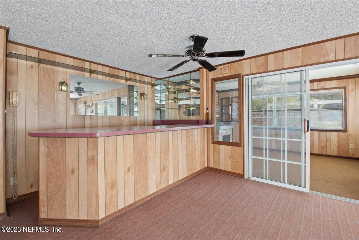 3048 Stratton Lane Jacksonville, FL 32221 - Photo 29 of 41 a view of a room with wooden floor and windows