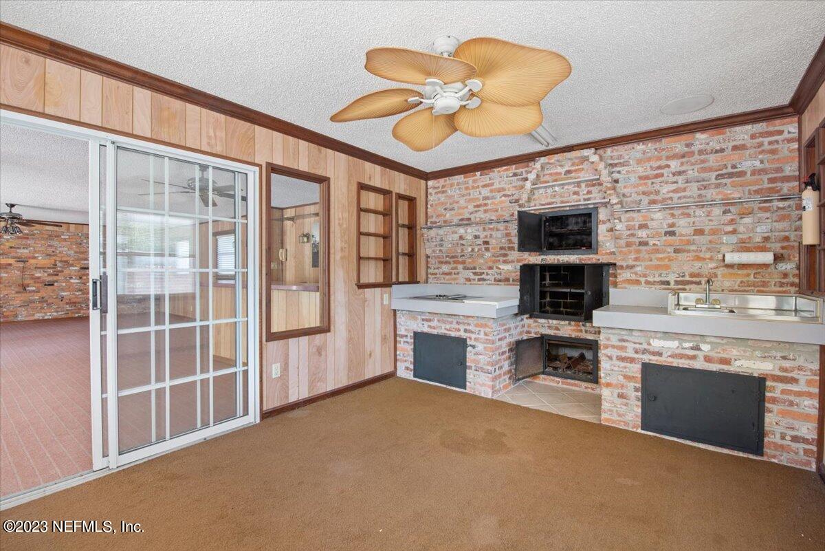 3048 Stratton Lane Jacksonville, FL 32221 - Photo 30 of 41 a kitchen with stainless steel appliances granite countertop a stove and a refrigerator