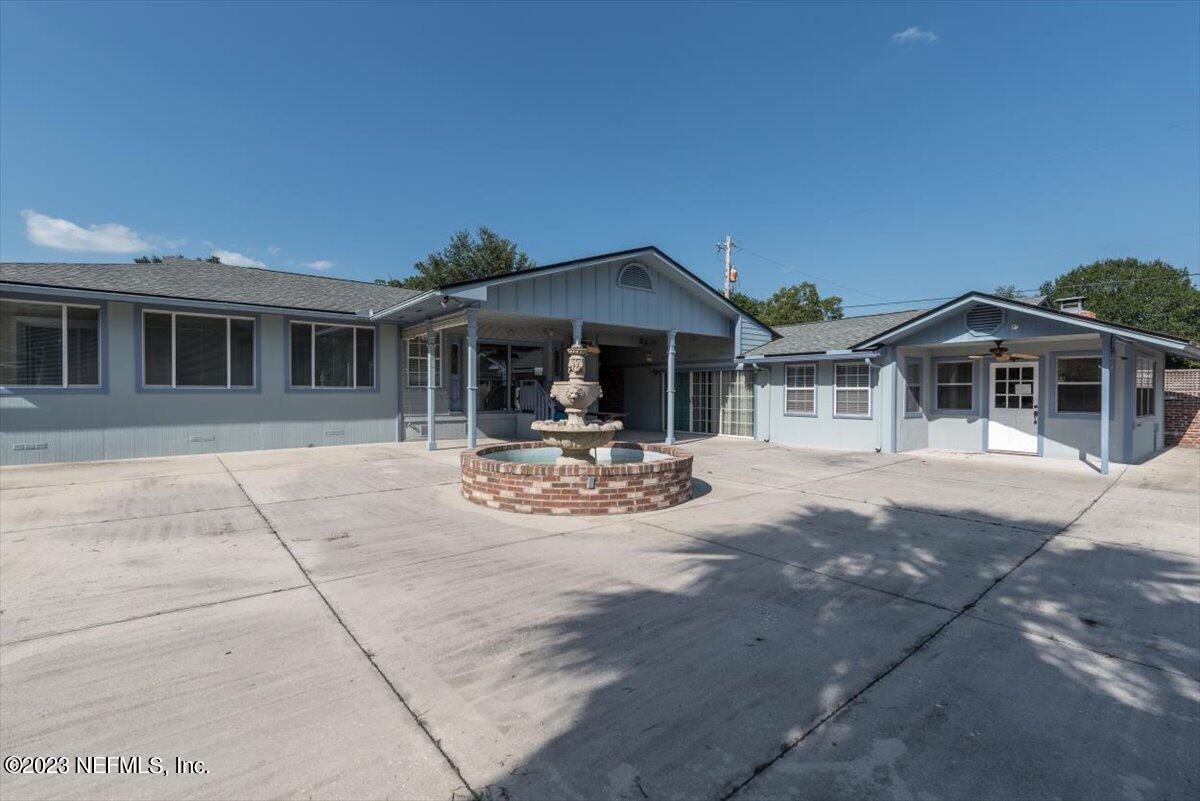 3048 Stratton Lane Jacksonville, FL 32221 - Photo 33 of 41 a view of a white house with swimming pool in front of it