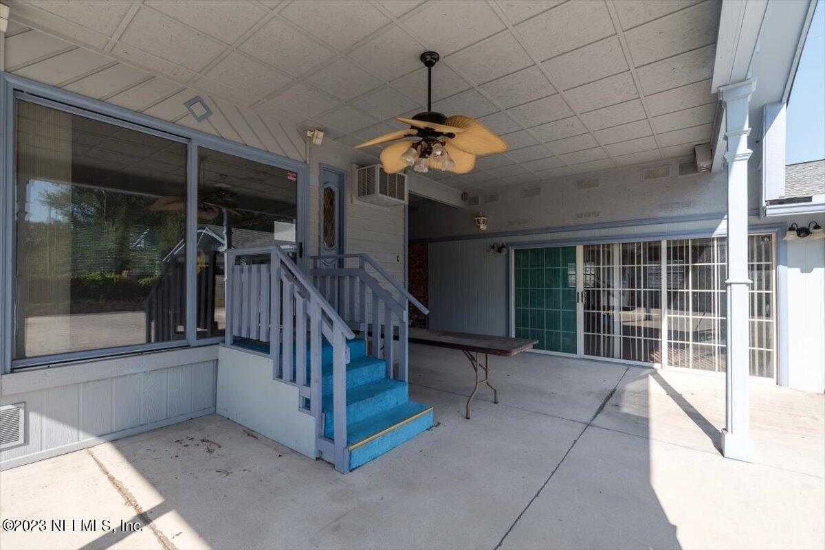 3048 Stratton Lane Jacksonville, FL 32221 - Photo 34 of 41 a view of staircase with a table and chairs