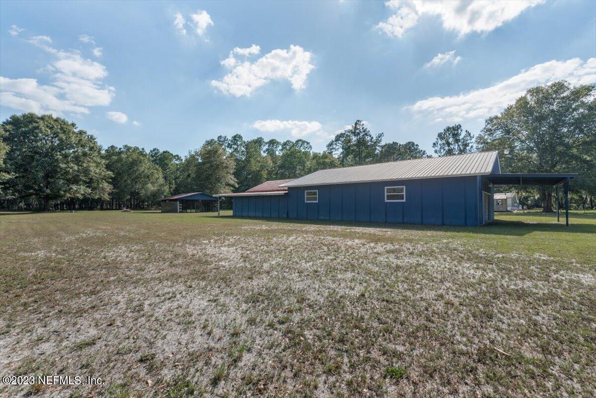 3048 Stratton Lane Jacksonville, FL 32221 - Photo 39 of 41 a view of a house with a yard