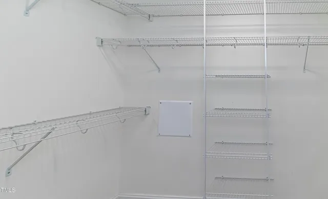 a view of an empty walk in closet