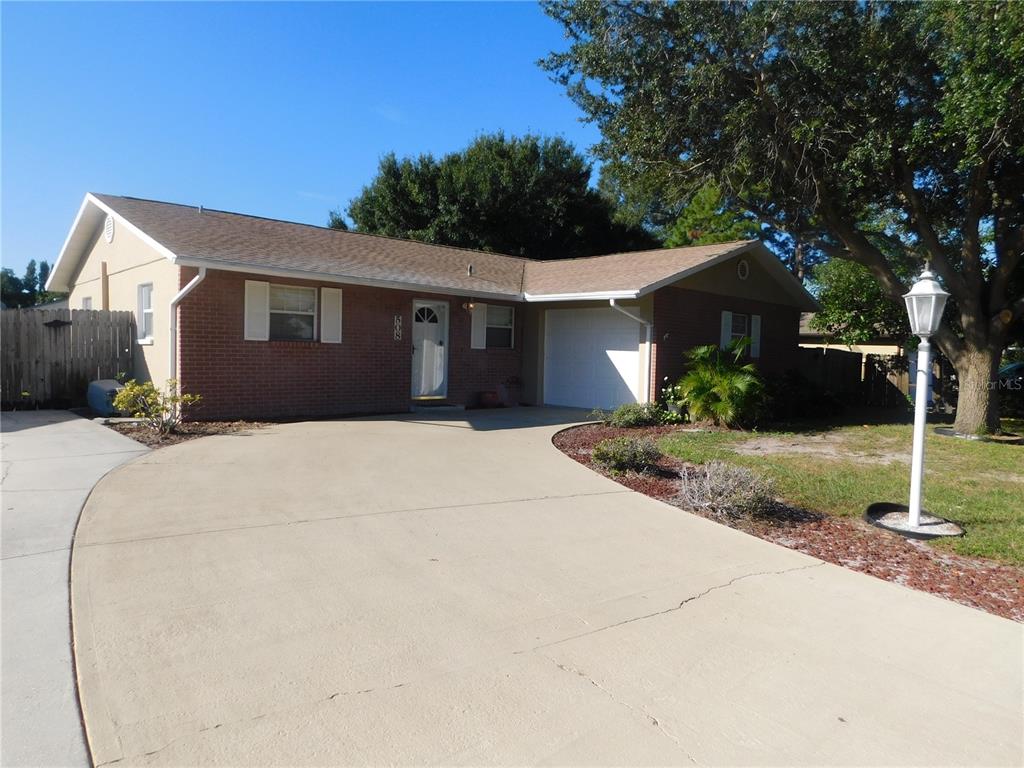 508 65th Avenue West Bradenton, FL 34207 - Photo 1 of 33 a front view of a house with a yard and garage