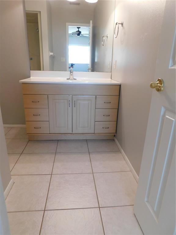 508 65th Avenue West Bradenton, FL 34207 - Photo 11 of 33 a bathroom with a granite countertop sink a toilet and a mirror